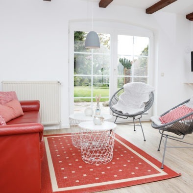Wohnzimmer und Terrasse der Ferienwohnung Landleev